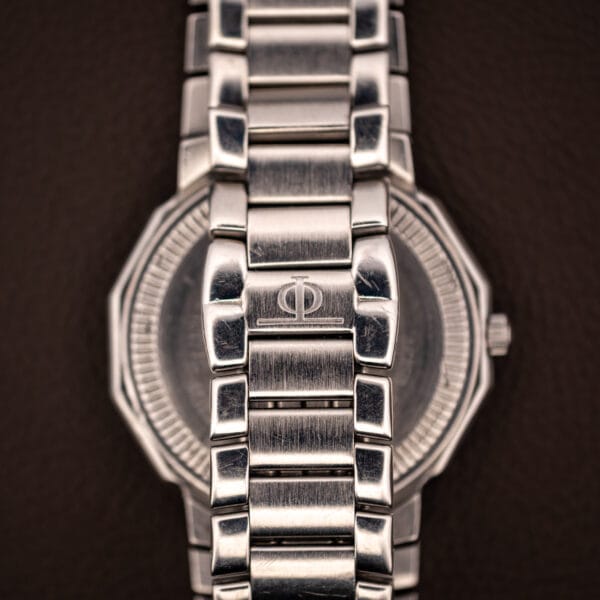 Baume & Mercier Riviera deployant clasp engraved with the Phi logo over the dodecagonal caseback