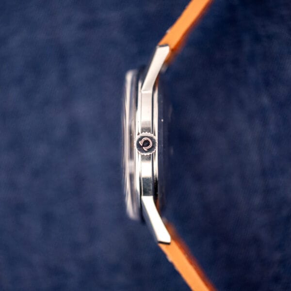 Omega 14772 stainless steel case side profile with the Omega-signed crown stamped with the Omega symbol