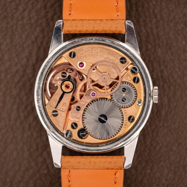 Omega caliber 285 manual-wind movement with copper-gilt bridges signed OMEGA SWISS SEVENTEEN 17 JEWELS