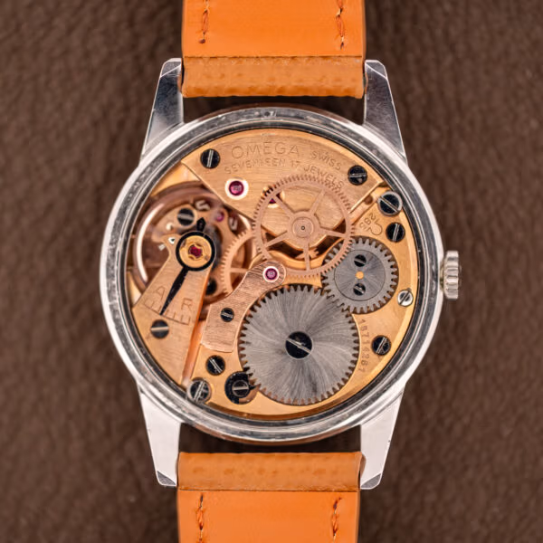 Omega caliber 285 manual-wind movement with copper-gilt bridges signed OMEGA SWISS SEVENTEEN 17 JEWELS