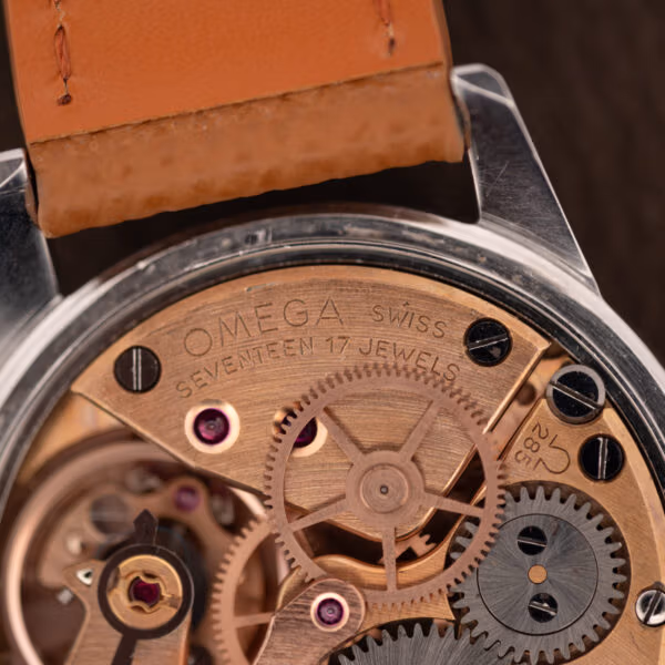 Omega caliber 285 bridge stamped OMEGA SWISS, SEVENTEEN 17 JEWELS and the caliber number 285