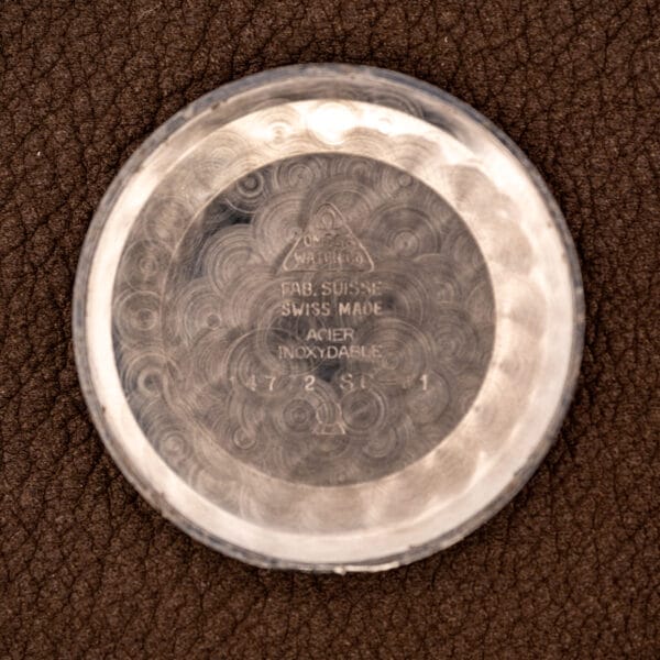 Omega 14772 inner caseback stamped FAB. SUISSE, SWISS MADE, ACIER INOXYDABLE with reference 14772 SC