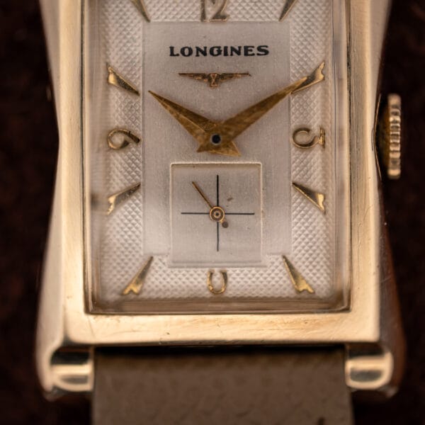Longines 2148-1 silver dial with clous-de-Paris textured flanks and a rectangular cross-hair sub-seconds register at six