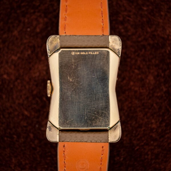 Longines 2148-1 caseback stamped 10K GOLD FILLED, showing the cinched hourglass case silhouette