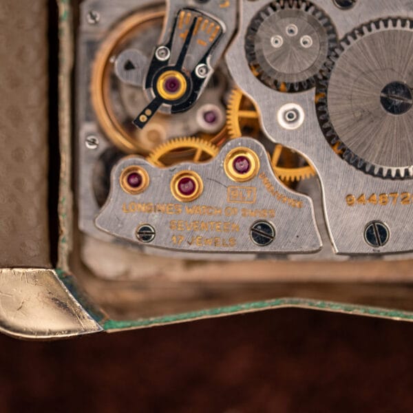 Longines caliber 9LT movement macro reading SEVENTEEN and 17 JEWELS ADJUSTED across the gilt bridge