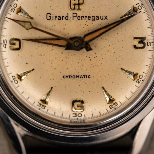 Girard-Perregaux 6170 lower dial detail with GYROMATIC text, SWISS marking and faceted applied hour markers