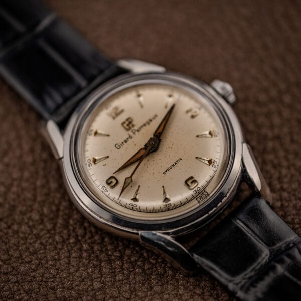 Girard-Perregaux 6170 angled view showing cream dial, SWISS at six o clock and polished steel case profile