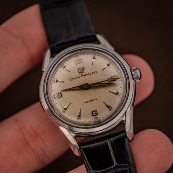 Girard-Perregaux Gyromatic 6170 in hand with SWISS dial marking, applied numerals and aged amber lume