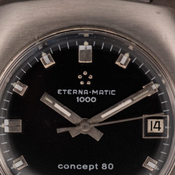 Eterna Matic 1000 Concept 80 black dial close-up with the five-dot Eterna logo and applied faceted markers