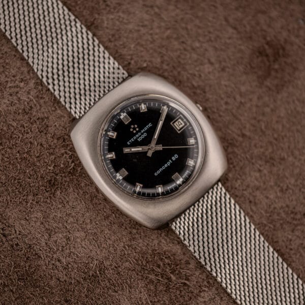 Eterna Matic 1000 Concept 80 cushion case and black dial on steel mesh bracelet, top-down view