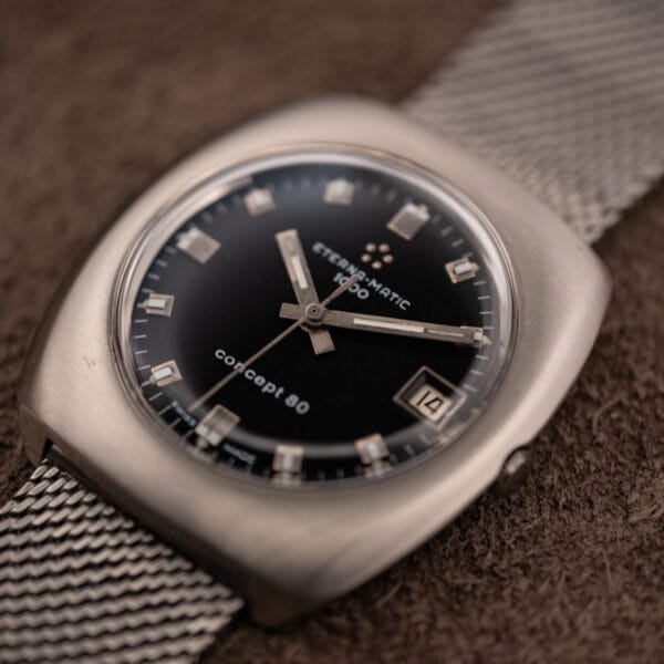 Eterna Concept 80 ref 156T brushed steel cushion case angled with crown and milanese mesh bracelet