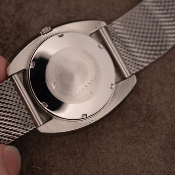 Eterna ref 156T open case interior showing the stamped serial number with the snap caseback removed