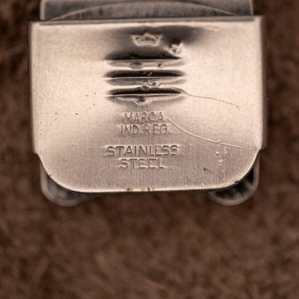Steel mesh bracelet deployant clasp interior stamped with a crown, MARCA IND.REG and STAINLESS STEEL