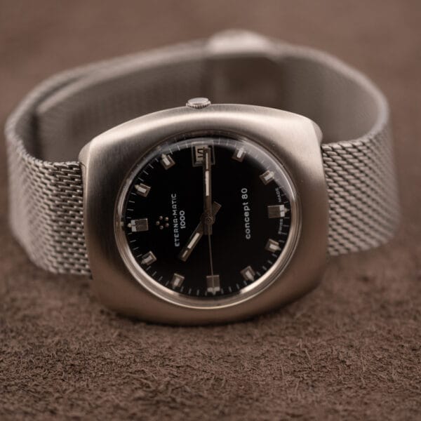 Eterna Concept 80 cushion case profile with crown, domed crystal and steel mesh bracelet