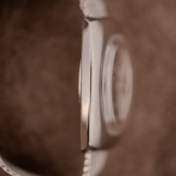 Eterna Concept 80 case band and domed acrylic crystal edge in profile detail
