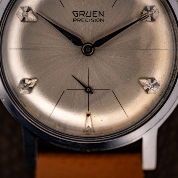 Gruen Precision lower dial close-up with small-seconds register, diamond markers and SWISS printed near six