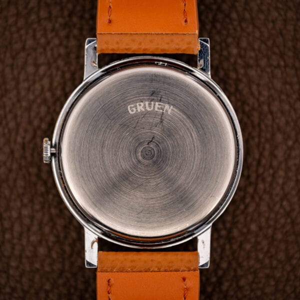 Vintage Gruen Precision outer caseback signed GRUEN with swirled brushed finish and honest wear