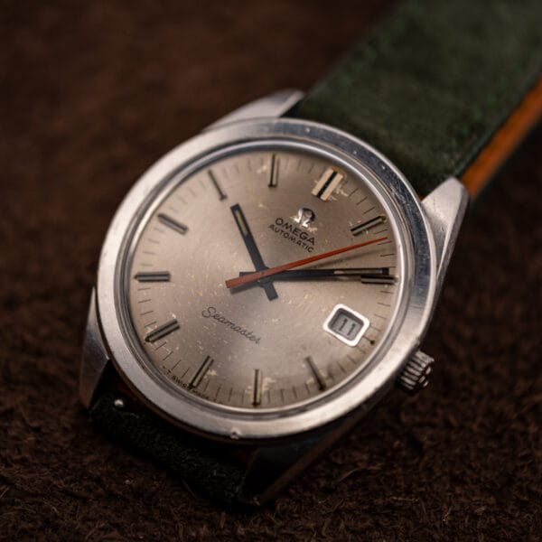 Omega Seamaster 166.028 three-quarter view, date window at three and orange central seconds hand