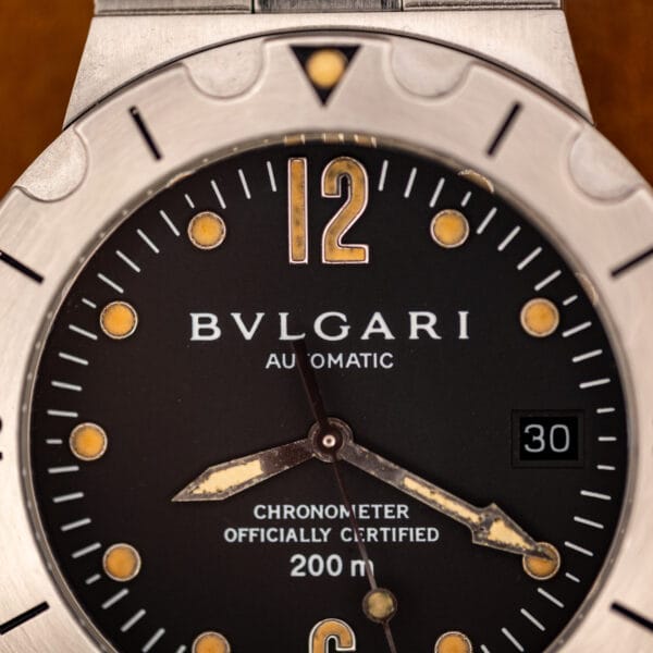 Bulgari Diagono Scuba dial close-up showing applied Arabic 12 and aged cream lume dot markers