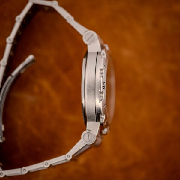 Bulgari Diagono Scuba case flank with scalloped diver bezel marked 45 and brushed steel finish