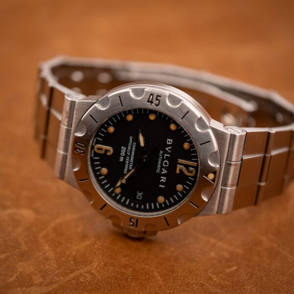 Bulgari Diagono Scuba SD38S standing three-quarter view of black chronometer dial and steel diver bezel