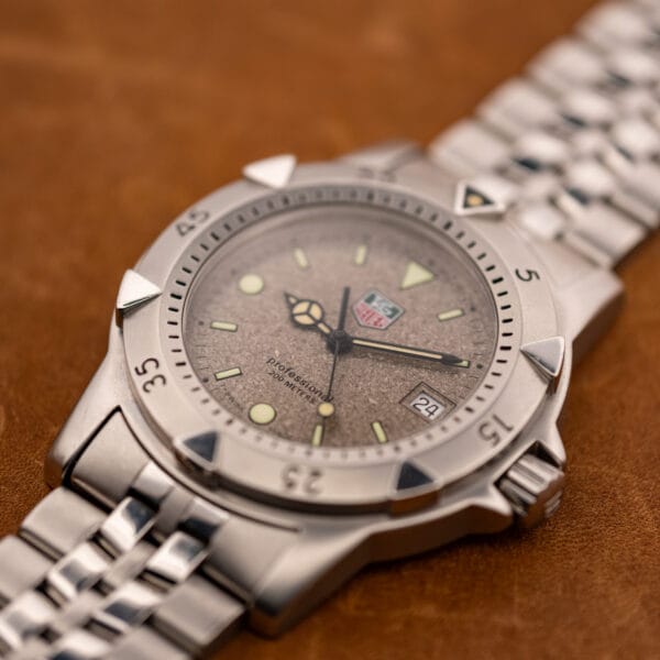 TAG Heuer 1500 Series WD1211-K-20 angled view of granite dial, uni-directional dive bezel and steel bracelet