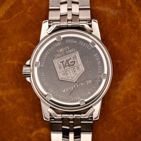 TAG Heuer 1500 Series caseback stamped WATER RESISTANT 200m TESTED, SAPPHIRE CRYSTAL, SWISS MADE, ref WD1211-K-20