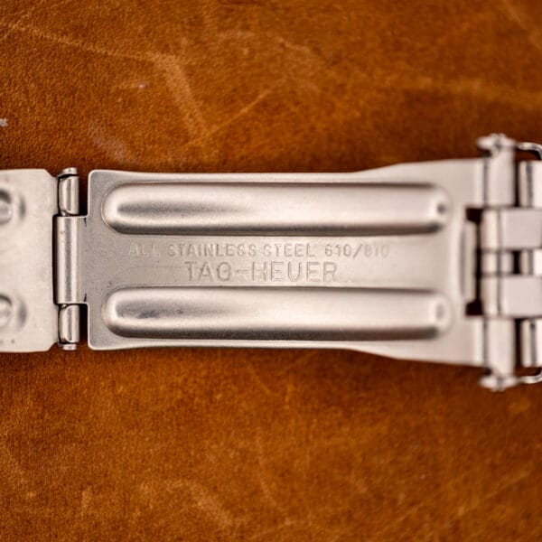 TAG Heuer bracelet clasp interior stamped STAINLESS STEEL 610/810 and TAG-HEUER