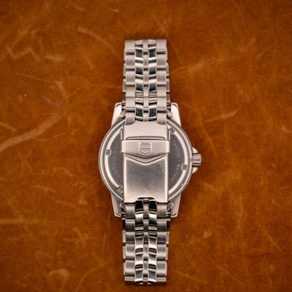 TAG Heuer 1500 Series steel beads-of-rice bracelet and folding clasp viewed from the reverse