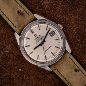 Omega Seamaster Chronometer 168.022 top-down on olive Ostrich strap with sandblasted silver-white dial and date at three