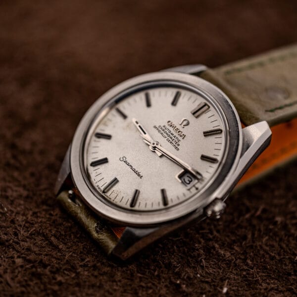 Omega Seamaster 168.022 dramatic angled view highlighting matte grained silver-white dial and applied markers