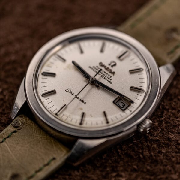 Omega Seamaster automatic chronometer angled dial view with date window and Omega signed crown