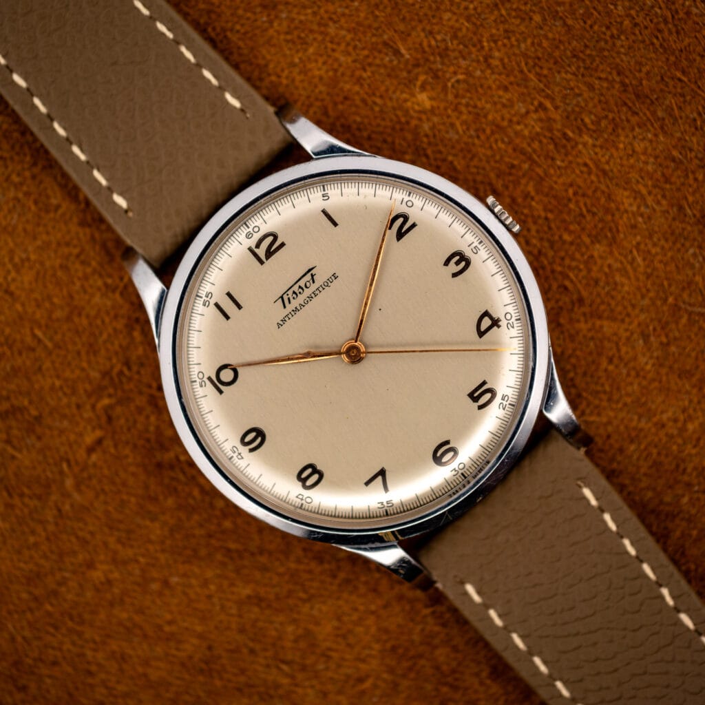 Tissot Antimagnetique ref 66718 cream dial with gilt Arabic numerals and rose-gilt leaf hands, full front view