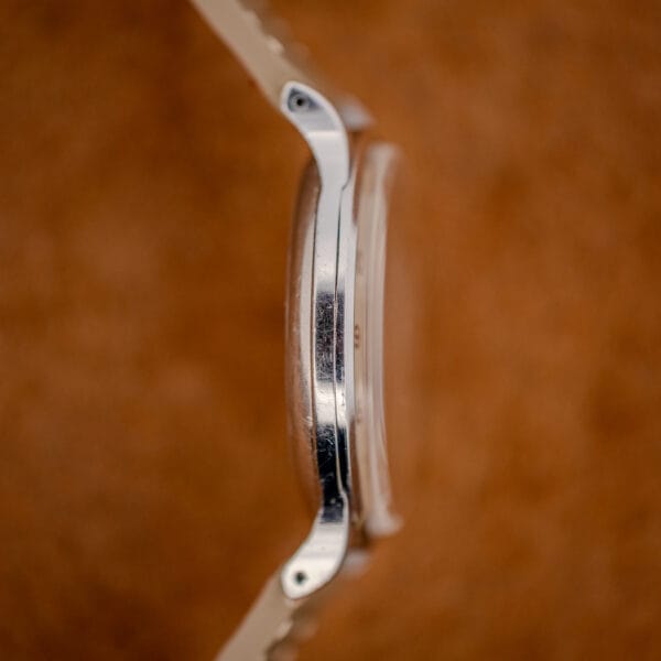 Tissot Antimagnetique 66718 opposite case profile with curved teardrop lugs and tall domed crystal