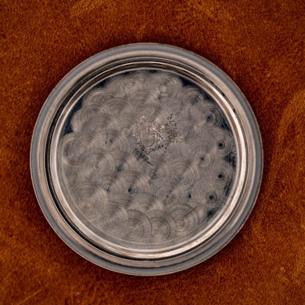 Glycine Airman inner caseback showing circular machining and faint engraving, interior view