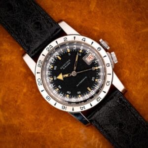 Glycine Airman GMT automatic black 24-hour dial on black ostrich strap, top-down view