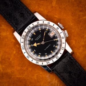 Glycine Airman GMT automatic black 24-hour dial on black ostrich strap, top-down view