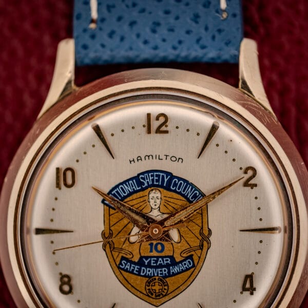Hamilton Thin-O-Matic cream dial close-up showing the National Safety Council crest and 10 Year Safe Driver Award emblem