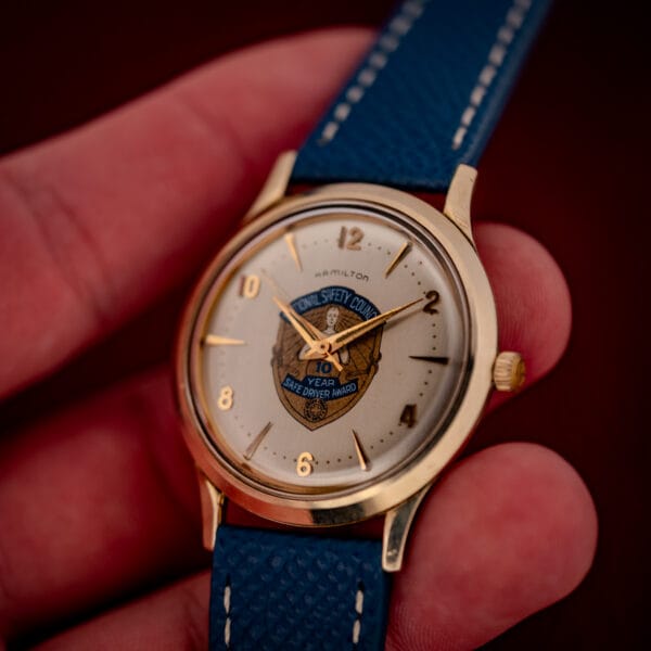 Hamilton Thin-O-Matic wrist-side view, cream presentation dial and blue leather strap with gold filled case