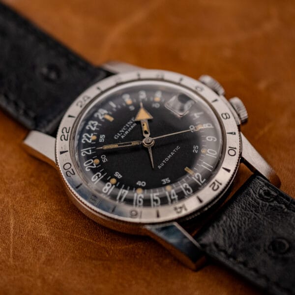 Vintage Glycine Airman automatic on ostrich strap, twin crowns and 24-hour bezel, angled view
