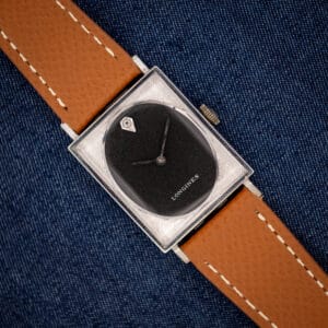 Vintage Longines Tank 3007-528 black oval dial in engine-turned square white gold filled case on honey strap