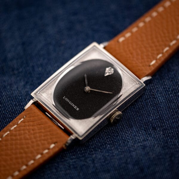 Longines Tank 3007-528 black dial with signed crown at three, white gold filled case on honey leather