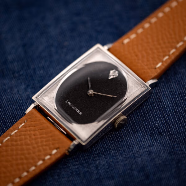 Longines Tank 3007-528 black dial with signed crown at three, white gold filled case on honey leather