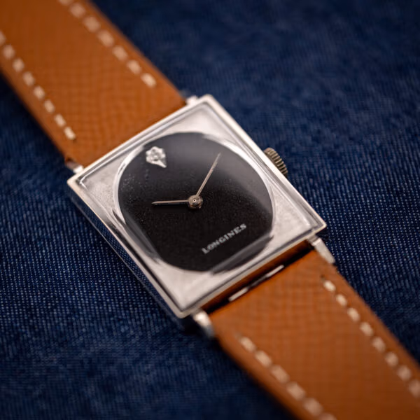 Longines 3007-528 overhead view, glossy black oval dial recessed in engine-turned square case