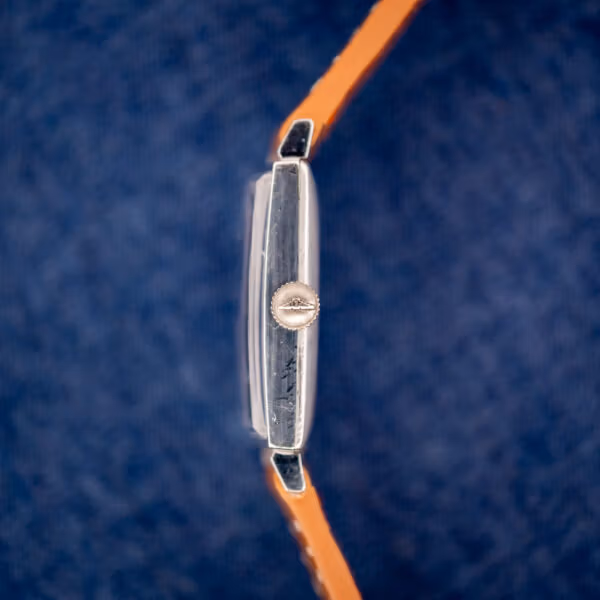 Vintage Longines tank side profile with Longines signed winged-hourglass crown at three
