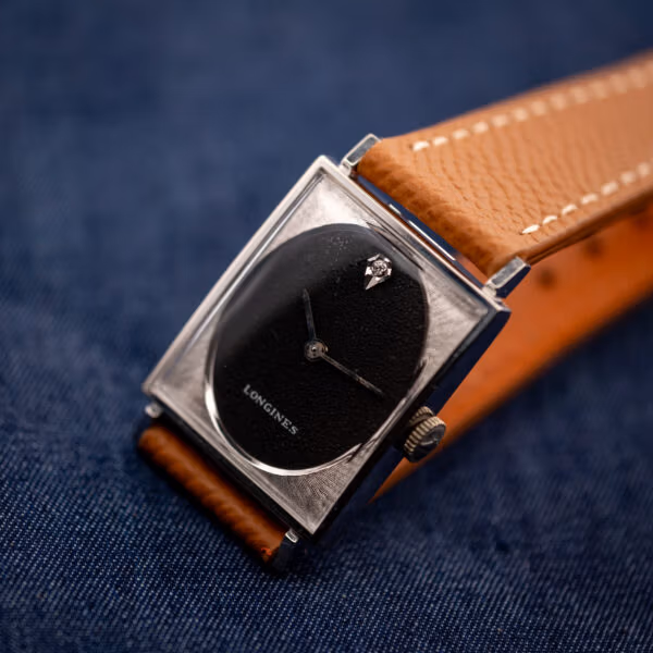 Longines Tank 3007-528 angled with LONGINES dial signature and honey leather strap, OTTUHR buckle