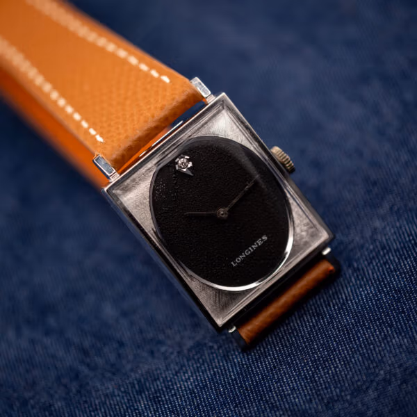 Longines 3007-528 black oval dial close angle, diamond at twelve and engine-turned square bezel