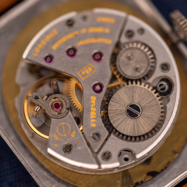 Longines caliber 528 macro showing balance wheel, jewels and SEVENTEEN 17 JEWELS engraving