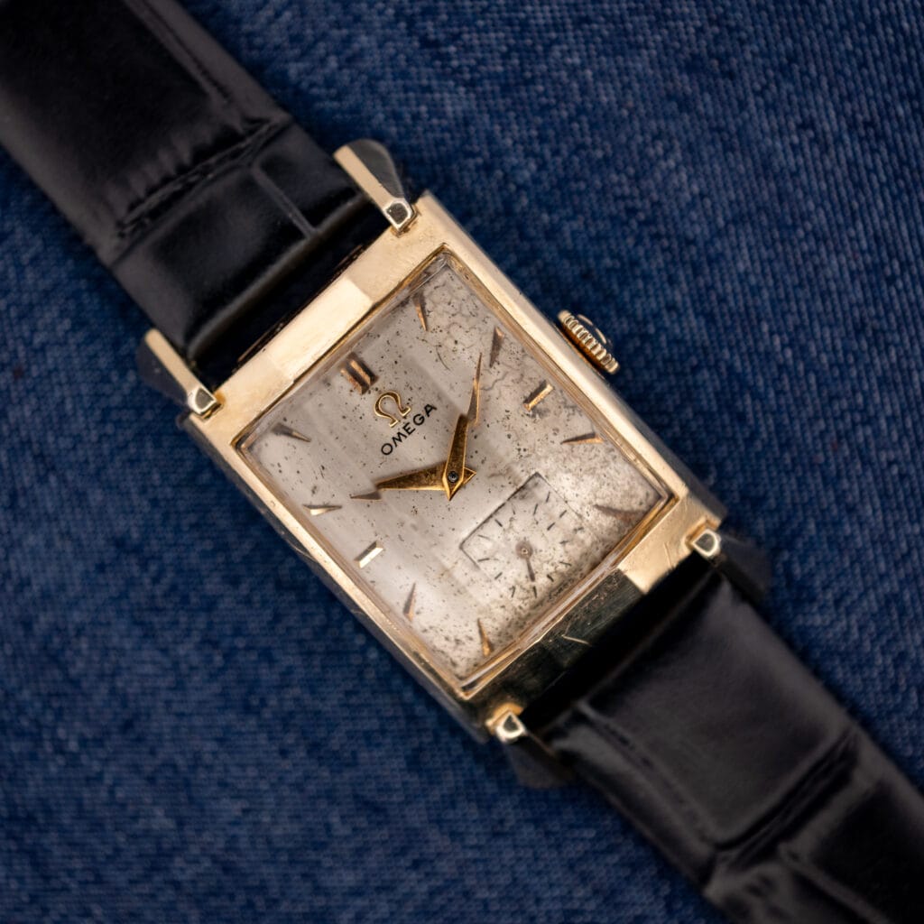 Vintage Omega Tank N-6243 gold filled Art Deco case with cream patinated dial on black leather strap