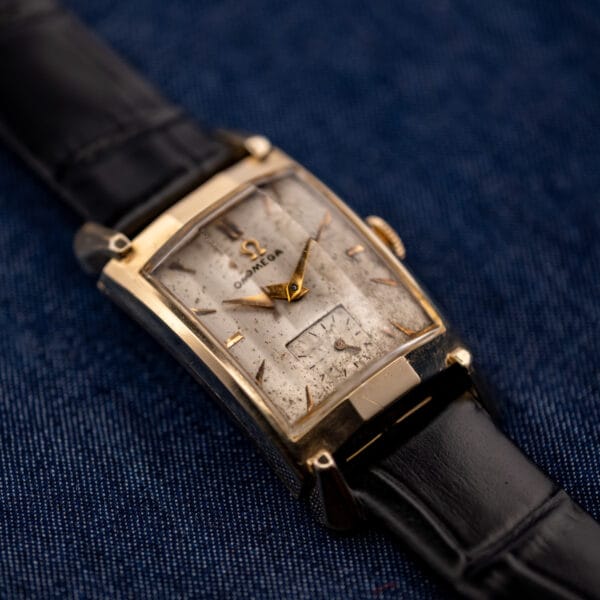 Omega Tank N-6243 angled view showing faceted fancy lugs and curved gold filled case